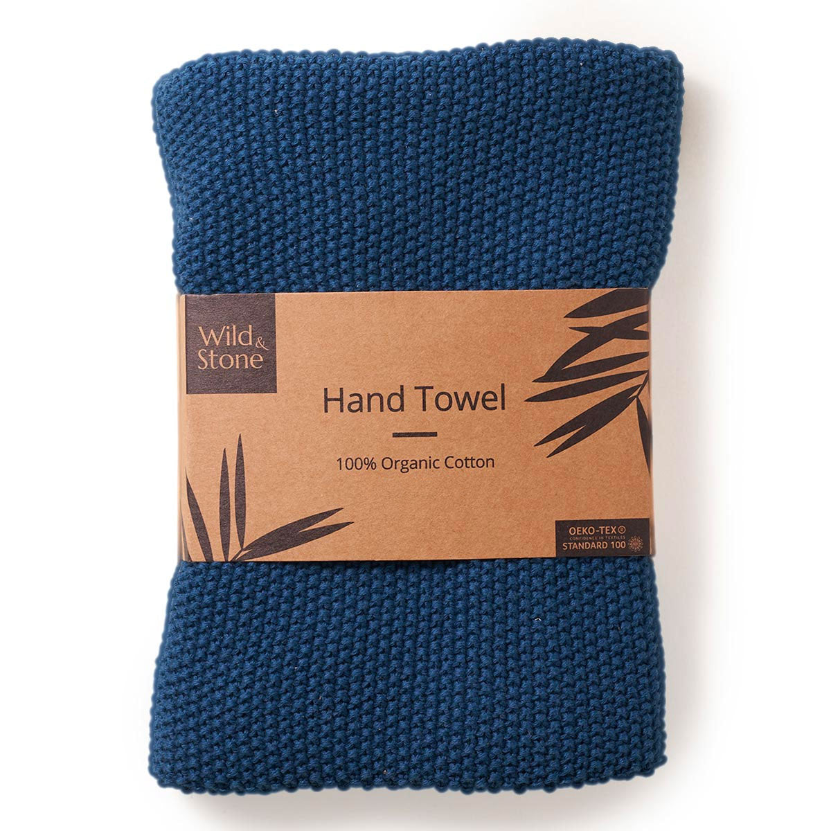 Wild and Stone organic cotton hand towel in the ocean blue colour folded in its cardboard sleeve on a white background