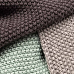 Close up of the knitted organic cotton texture on the Wild and Stone dish washing cloths