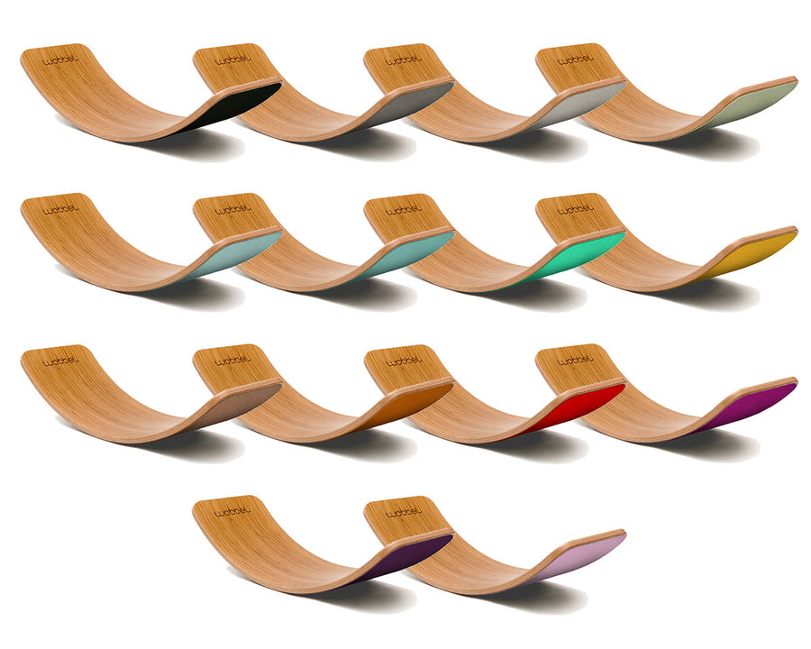 Full range of Wobbel Bamboo balance boards laid out on a white background