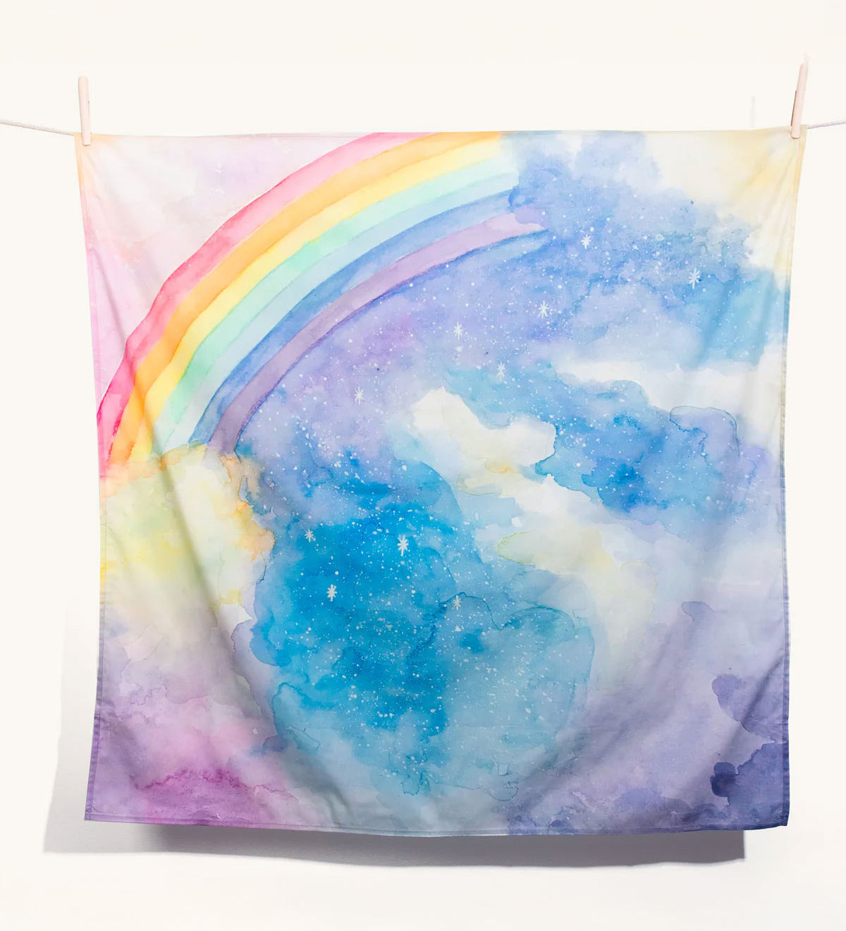 The Wonderie giant magical sky rainbow design play cloth on a plain background. 