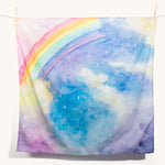 The Wonderie giant magical sky rainbow design play cloth on a plain background. 