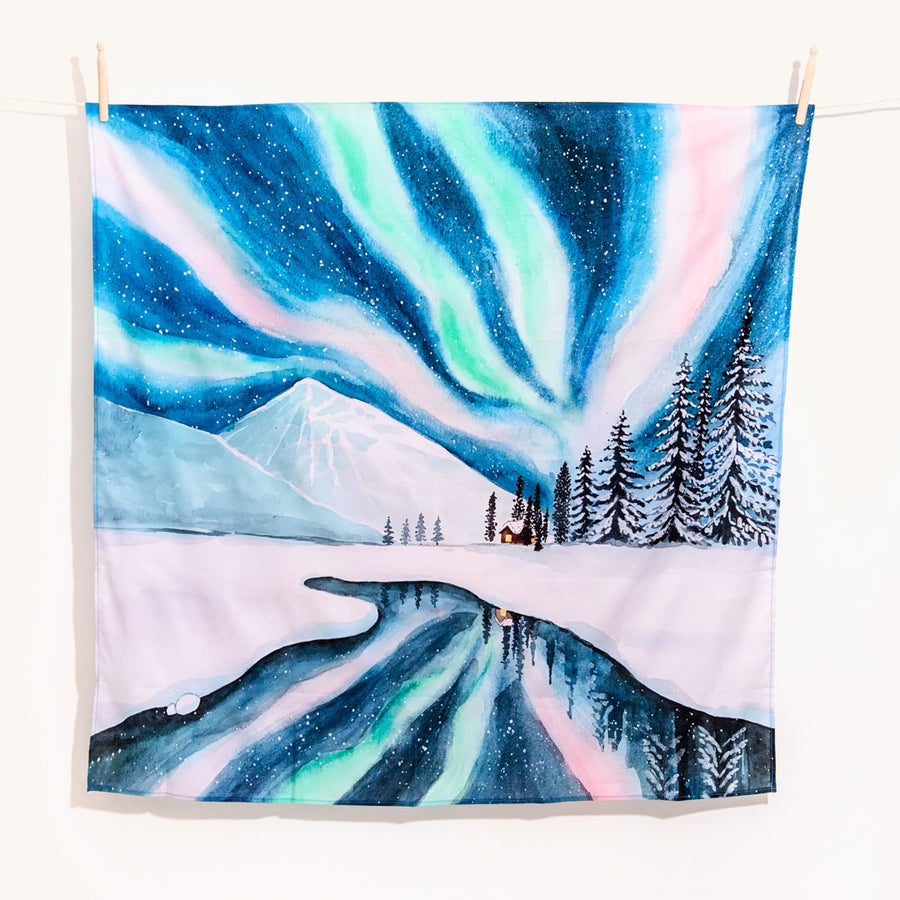 Wonderie Play Cloth - Waves of Light in the Night design pictured hanging up on  plain background