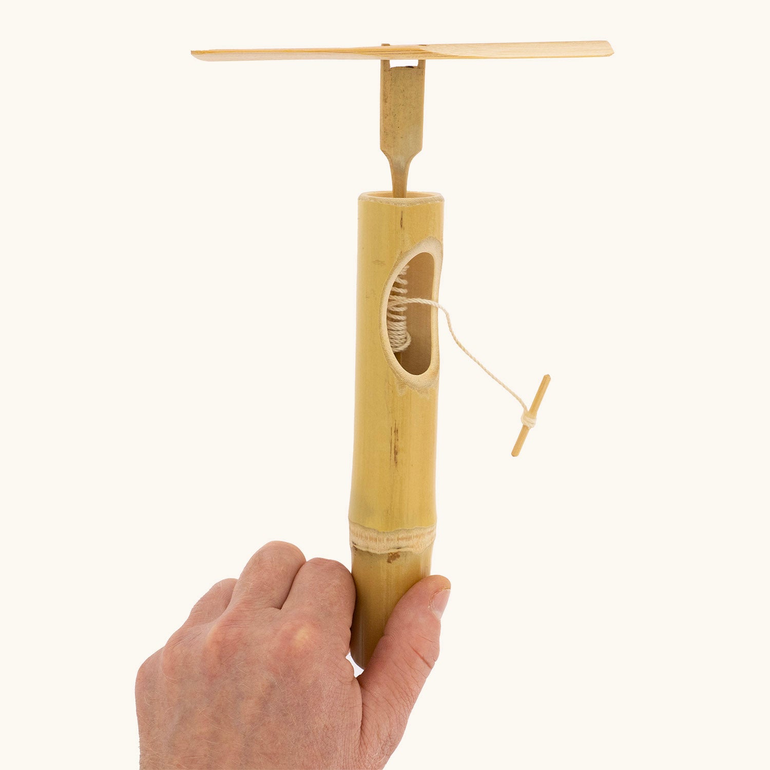 Child demonstrating how to launch the Kraul Super Bamboo Dragonfly.