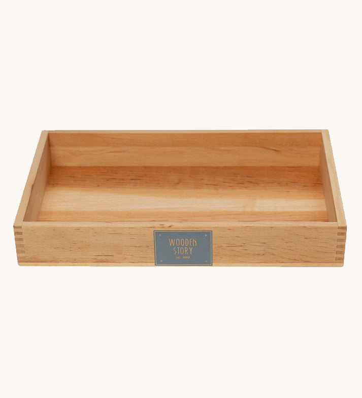 Wooden Story Large Deep Work Tray. The image shows the natural wood grain of the wood, and there is a Wooden Story logo on the front of the tray.