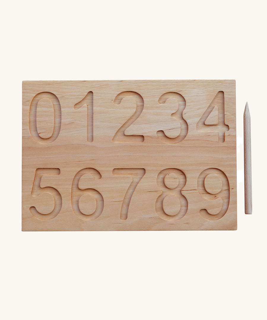 The number side of the Wooden Story Number Tracking Board with the wooden pencil next to it on a plain background. 