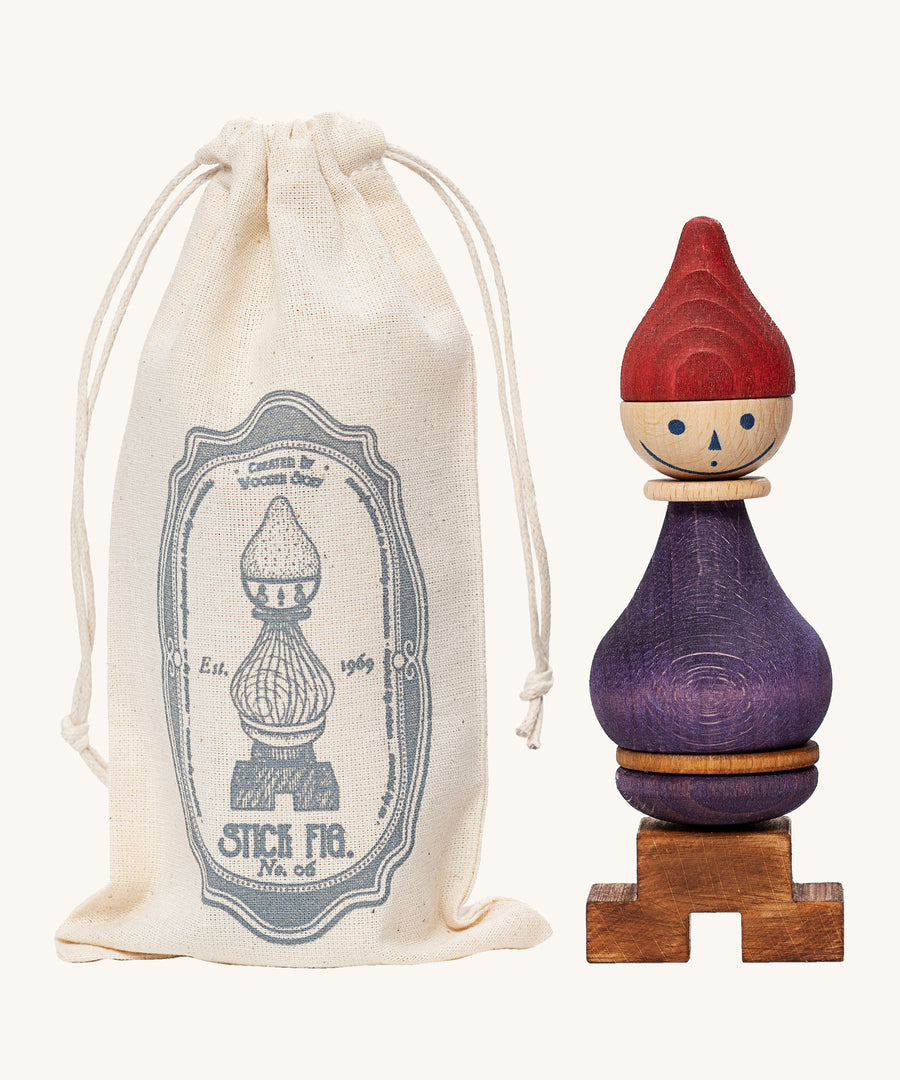 Wooden Story Stacking Toy Stick Figure - No6 next to its cotton drawstring storage bag.