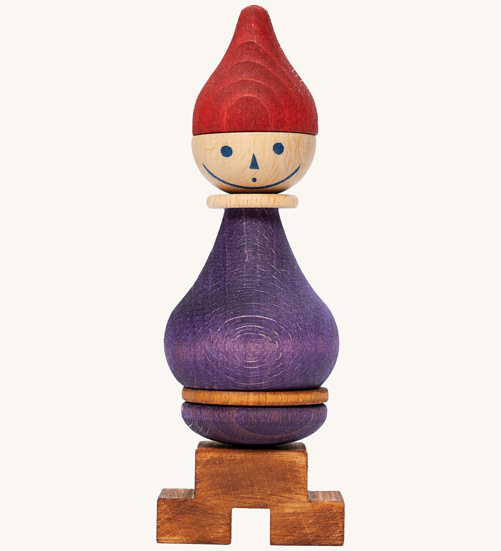 Wooden Story Stacking Toy Stick Figure - No6, a purple stacking wooden figure wearing a red hat. 