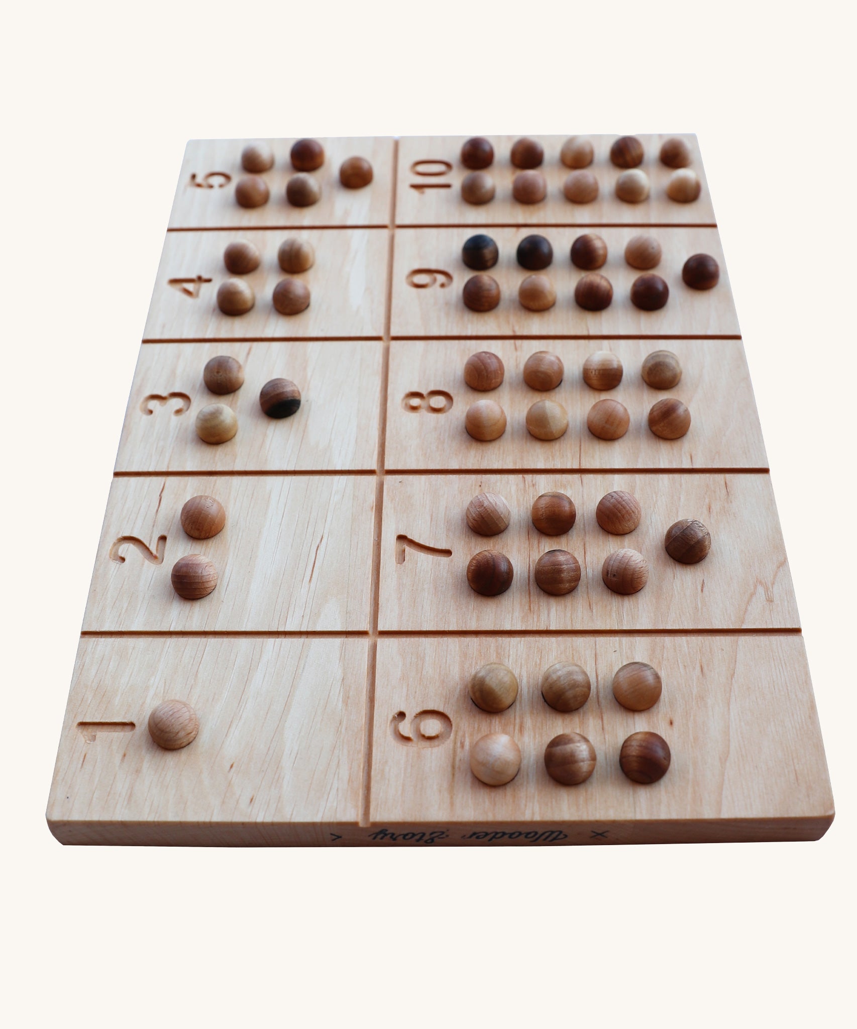 Wooden Story Number Tracking Board with wooden balls on a plain background. 