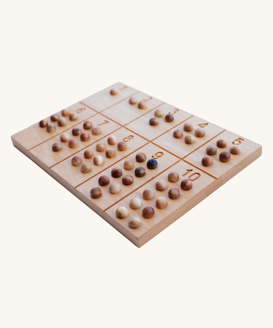 Wooden Story Number Tracking Board with wooden balls on a plain background. 