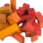 A close up of the yellow, orange and red coloured blocks from teh Wooden Story 100 Rainbow Blocks in Sack set. 