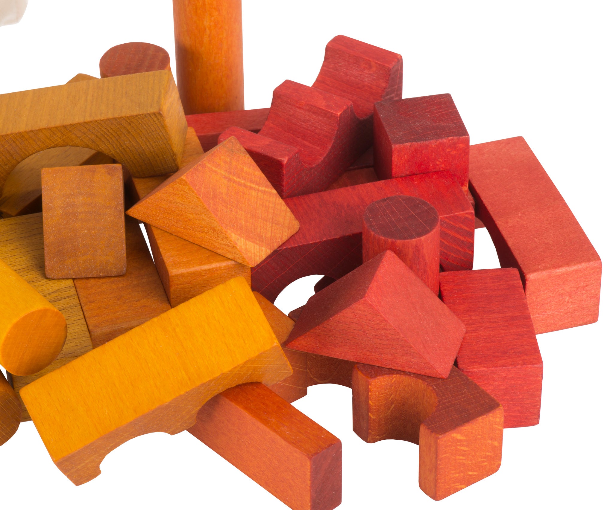 A close up of the yellow, orange and red coloured blocks from teh Wooden Story 100 Rainbow Blocks in Sack set. 