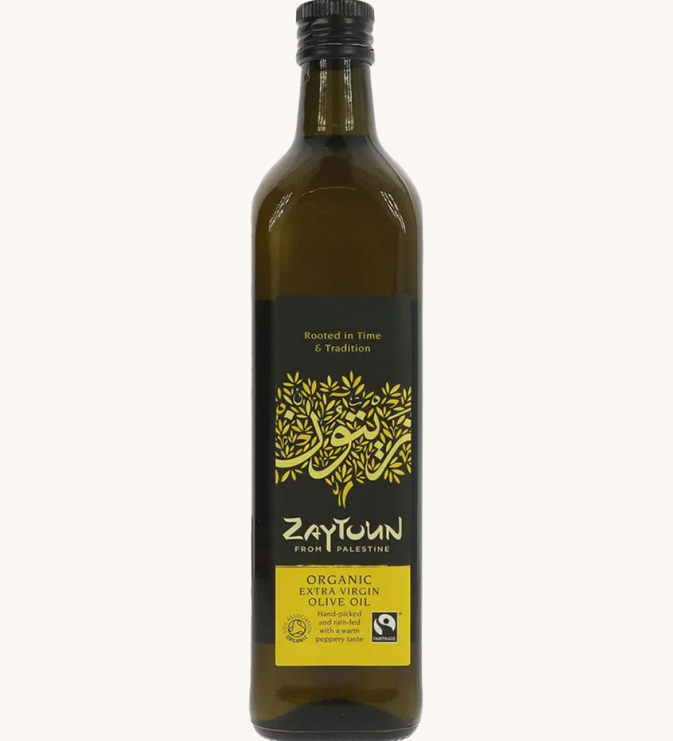 A 750ml bottle of Zaytoun Organic Extra Virgin Olive Oil on a plain backgroun.d 