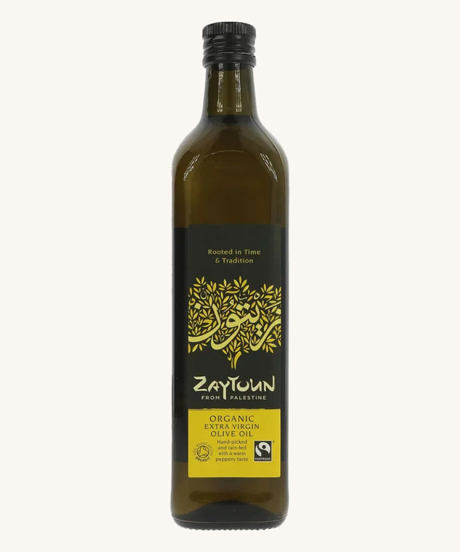 A 750ml bottle of Zaytoun Organic Extra Virgin Olive Oil on a plain backgroun.d 